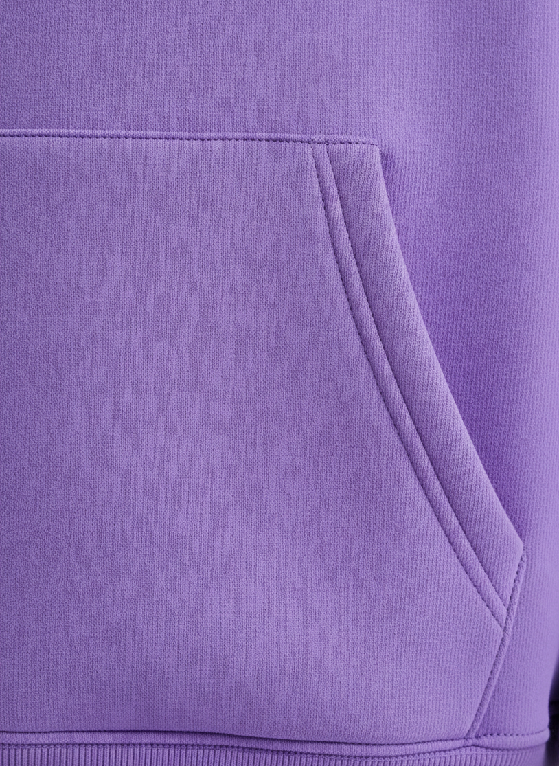 Close-up of a purple garment with a pocket detail